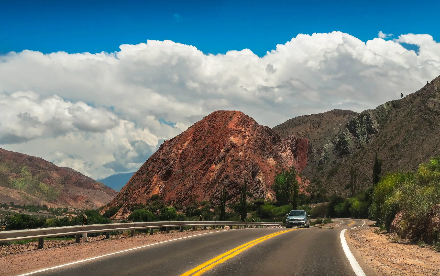 Car travelling along a scenic open road