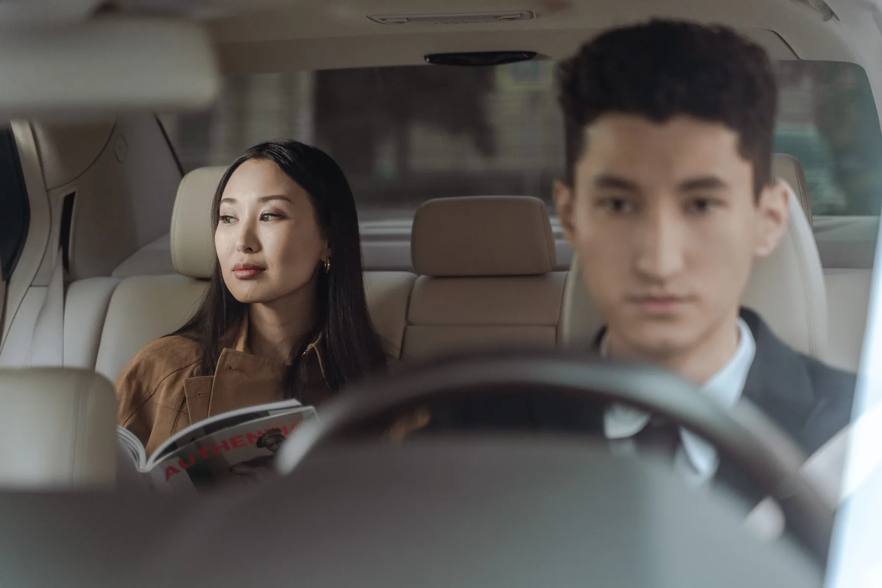 Passenger seated comfortably inside a professionally driven car